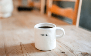 Coffee mug with "Begin" on it