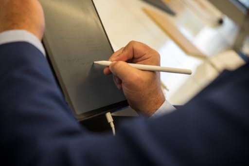 Marc A. Pitman taking notes