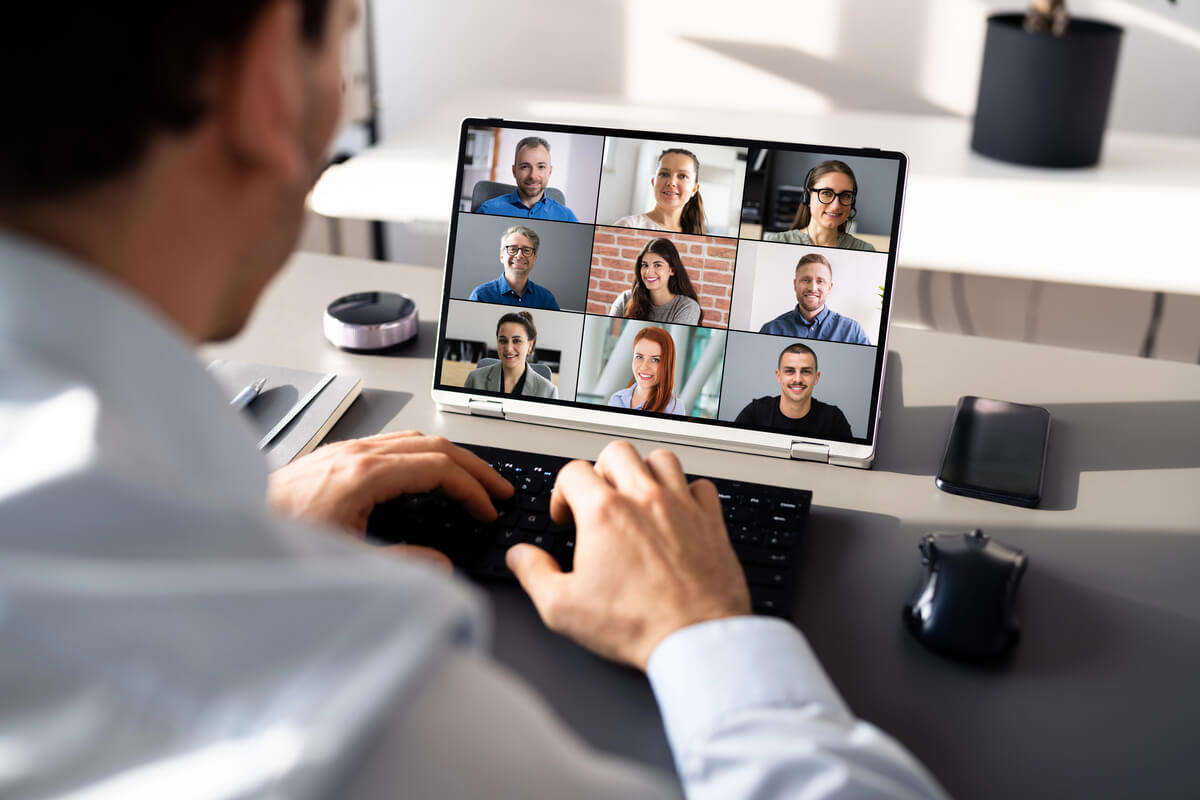 Feature image of laptop with a conference call