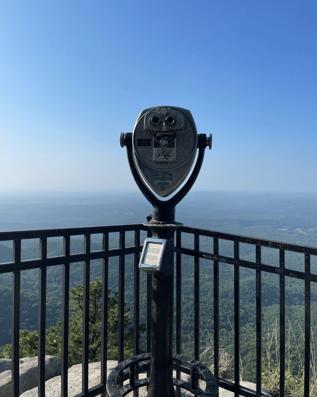 lookout point (at Caesar’s Head) paid binocular stand looking out over a valley in Western SC.